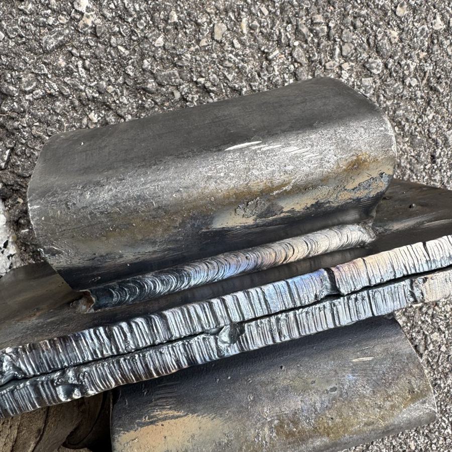 Close-up of stacked weld beads on pipe