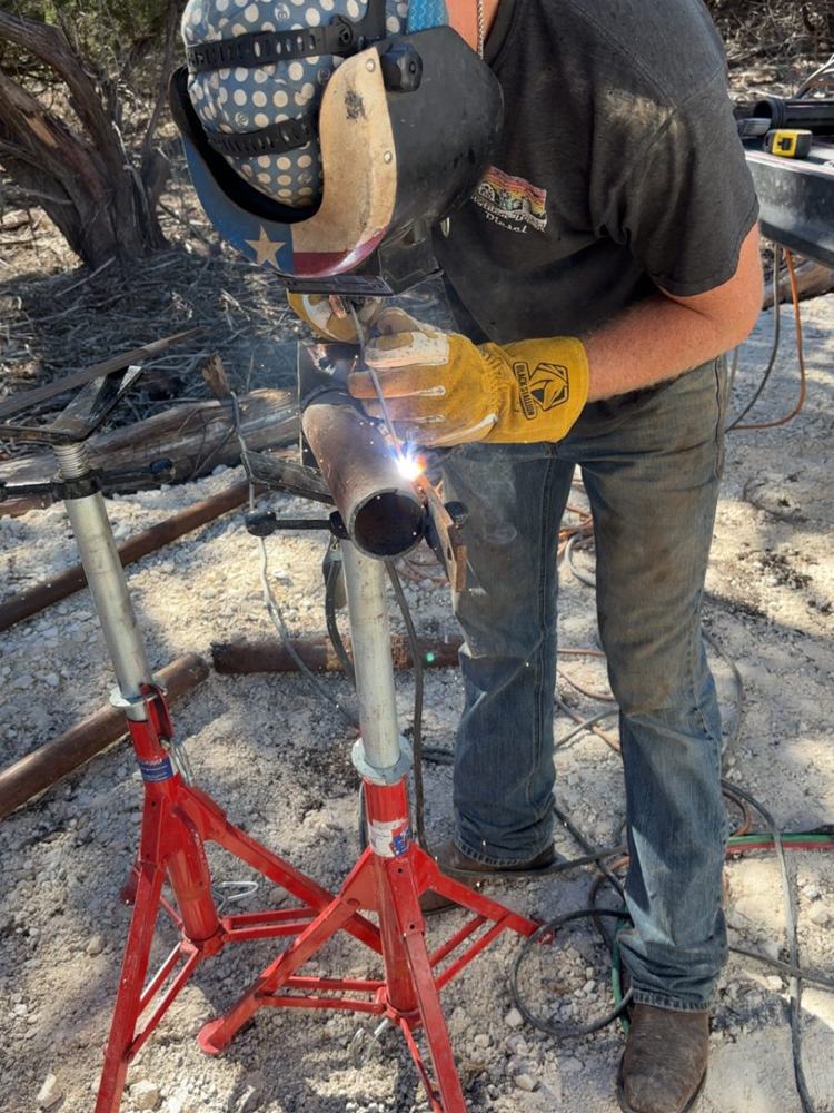 Luke grinding a pipe joint on stands