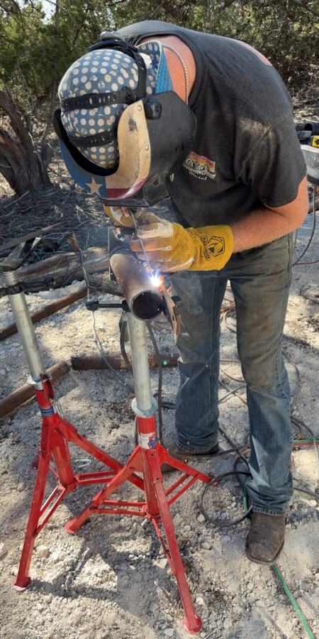 Luke fitting pipe on stands